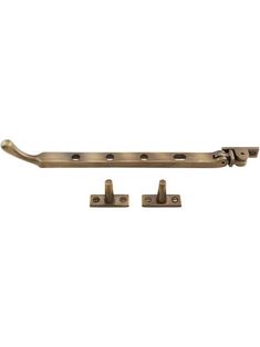 an antique brass door handle with two latches on each side and three holes in the middle