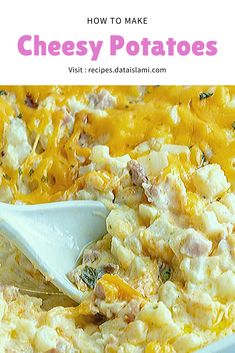 cheesy potatoes in a casserole dish with a spoon