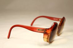 "Vintage 80s eyeglasses Christian Dior Optyl translucent orange color. High quality materials. Large frame with personality. They have a prescription lens that could be replaced. Frame Germany / Model: 2021-30 / Size: 54▢13-125. Ref: OB0030 CONDITION: Excellent DIMENSIONS: Bridge: 13 mm / 5,12\" Lens width: 54 mm / 21,26\" Lens height: 55 mm / 21,65\" Frame width: 134 mm / 52,76\" Temple length: 125 mm / 49,21\" More vintage items in my online shop: http://www.vintagecarwen.com" Orange Retro Sunglasses For Party, Vintage Orange Sunglasses With Mirrored Lenses, Rectangular Orange Sunglasses With Gradient Lenses, 1980s Glasses, Vintage Orange Juice Glasses, 1970s Eyeglasses, Silver Buttons, Vintage Bags, Zebra Print