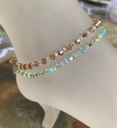 "Romantic & Beautiful Swarovski Crystal Clear AB bracelet! This listing is for the one anklet or bracelet. Buy multiple for layering your bracelets. They are gorgeous for everyday or for that special occasion. Lots of sparkles & shimmers ! *I made these beautiful sparkling Aanklets/bracelets. These Anklets/Bracelets are made with Swarovski 4 & 3 mm crystal AB.in different colors. Choose your desired length in the drop down menu.It will be made with your choice of length plus .5 inch Crystal Anklets For Parties, Adjustable Sparkling Crystal Bracelet, Adjustable Crystal Anklets As Gift, Elegant Crystal Anklets With Adjustable Fit, Elegant Gold Crystal Anklets, Adjustable Gold Crystal Anklets, Beaded Ankle, Crystal Anklet, Ankle Jewelry