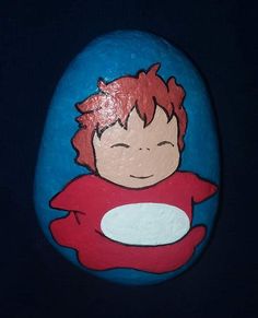 a painted rock with a cartoon character on it