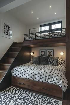 a bedroom with a bed, stairs and rugs on the floor in front of it