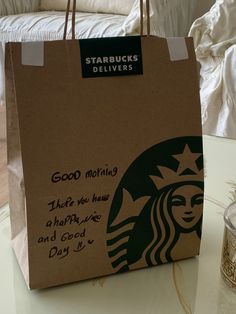 a starbucks bag sitting on top of a table