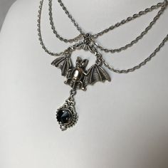 "This gothic vampire inspired necklace is made with an antiqued silver plated bat. filigrees and findings, accented with sparkling glass crystals in JET BLACK. Decorated portion is 6\" wide and centerpiece is 2 7/8\" tall in the center. Necklace is adjustable 15-18\" with a lobster clasp and chain extender in the back. If you would like a different length or stone color, please send us a message." Silver Vampire Style Necklace, Gothic Costume Jewelry Choker, Silver Vampire Style Metal Jewelry, Gothic Sterling Silver Jewelry For Parties, Gothic Costume Choker Necklace, Gothic Halloween Costume Necklace, Elegant Halloween Costume Jewelry, Nickel-free Gothic Necklaces For Party, Gothic Nickel-free Necklace For Halloween