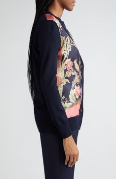 The label's signature paisley swirls are reinterpreted as a verdant floral paradise across a mixed-media cardigan boasting a sleek silk body and wool contrast. 28 1/2" length (size 8US/44IT) Front button closure V-neck Long sleeves Ribbed cuffs and hem 100% silk with 100% wool contrast Dry clean Made in Italy Designer Clothing Elegant Fitted Cardigan With Floral Print, Fitted Elegant Cardigan With Floral Print, Luxury Spring Cardigan For Formal Events, Silk Wool, Designer Clothing, Paisley, Paradise, Mixed Media, In Italy