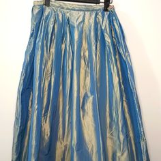 This Neiman Marcus Skirt Has Never Been Worn. It Is A Size 14 But Runs Small. This Flared Skirt Will Draw Anyone's Attention As Its Multi Colored Iridescent Colors Glow From Within. Gold Lined Full Skirt, Gold Full Lined Skirt, Gold Long Lined Skirt, Festive Lined Flared Skirt Bottoms, Festive Full Skirt With Lining, Festive Full Lined Skirt, Gold Flowy Full Skirt, Festive Full Flowy Skirt, Festive Flowy Full Skirt