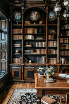 a wooden table sitting in front of a bookshelf filled with lots of books