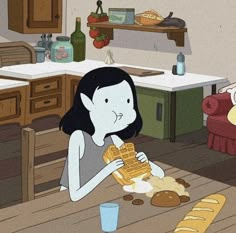 a woman sitting at a table eating waffles