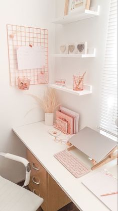 a white desk topped with a computer monitor and keyboard