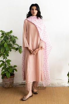 Salmon pink kurta with straight silhouette, delicate floral embroidery at the pockets and lace trim sleeves. Comes with straight fit pant and block print dupatta.
Component: 3
Printed, Embroidered
Neckline: Round
Sleeve Length: Full
Fabric: Handwoven Chanderi, Chanderi Tissue
Color: Pink
Delicate sequins on the kurta
Side pockets
Straight fit pant
Printed dupatta - Aza Fashions Block Print Dupatta, Best Designer Suits, Pink Kurta, Kurta Set For Women, Straight Fit Pants, Embroidered Neckline, Indian Fashion Designers, Pernia Pop Up Shop, Salmon Pink