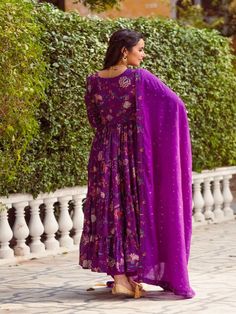 This Set Has a Anarkali, bottom and dupatta. Floral printed tier Anarkali set with hand embroided yoke. It is paired with matching chanderi foil print dupatta enhanced with fabric detailing and palazzo pants. Color: Purple Fabric: Anarkali - Cotton Silk Bottom - Shantoon Dupatta - Chanderi Product Details: Neck Type - Round neck Anarkali Length - 50 inches Bottom Length - 38-40 inches Sleeve Length - 22 inches Note: Available in other colors The product will be delivered within 2-4 weeks of orde Festival Cotton Silk Sharara With Printed Motifs, Festival Sharara With Printed Motifs In Cotton Silk, Designer Cotton Silk Anarkali Set With Printed Motifs, Chanderi Anarkali Set With Printed Motifs For Diwali, Festive Cotton Silk Sharara With Printed Motifs, Diwali Chanderi Anarkali Set With Printed Motifs, Festive Anarkali Set With Printed Motifs For Diwali, Festive Printed Motifs Anarkali Set For Diwali, Diwali Anarkali Set In Mulmul With Printed Motifs