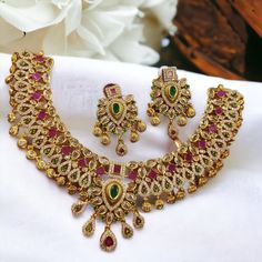 Add a touch of South Indian elegance to your ensemble with our Gold Finish Jewelry set. Crafted with budget-friendly materials, this set includes a stunning necklace and matching earrings. Elevate your style and save money with this must-have set. Elegant Multicolor Sets As Gift, Elegant Multicolor Sets For Gift, Elegant Multicolor Sets As A Gift, Elegant Multicolor Sets For Gifts, Formal Multicolor Necklace With Matching Earrings, Formal Multicolor Necklaces With Matching Earrings, Multicolor Kundan Necklace With Matching Earrings, South Indian Necklace, South Indian Jewelry