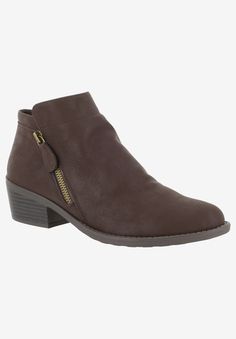 A fantastic fall-forward style that can be worn with an array of outfits through the cooler season. The Gusto Bootie by Easy Street features a bold metal side zipper for a dose of attitude and a super flexible and lightweight outsole constructed on a faux stacked heel. Soft manmade PU upperBold metal side zipper with self-pull tabManmade liningGenerously padded insole that cushions the footLightweight and flexible outsole3" shaft height; 11" shaft circumference1¾" faux stacked heel Ultra- Street Shoes, Of Outfits, Easy Street, Womens Ankle Boots, Black Leather Boots, Stacked Heel, Chukka Boots, Ankle Booties, Side Zipper