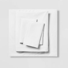 two white napkins sitting on top of each other