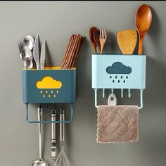 two kitchen utensils hanging on the wall next to a rack with spoons and spatulas