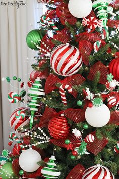 a christmas tree decorated with red, green and white ornaments