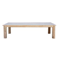 a wooden table sitting on top of a white floor