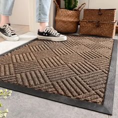 a woman standing on top of a rug in front of a basket and some shoes