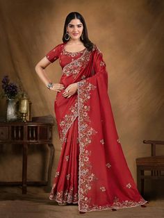 Make a statement with this exquisitely crafted red silk saree, designed to turn heads at any festival. The luxurious silk fabric showcases a breathtaking combination of sequence and cord embroidery, enhanced with intricate stonework, making it the perfect choice for those who appreciate true elegance. Versatility in Shades and FabricsThe vibrant red shade is ideal for festive occasions, symbolizing passion and celebration. Crafted from premium silk, this saree offers both comfort and opulence, a Saree For Indian Wedding, Red Silk Saree, Red Silk Blouse, Festival Attire, Indian Wedding Reception, Designer Kurti, Green Saree, Smart Dress, Red Saree