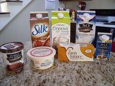 some ice cream, yogurt and other items on a counter