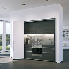 a kitchen with an open door leading to the outside