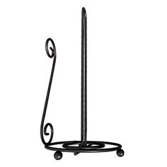 a black metal holder with wheels and a handle on the top is holding an umbrella