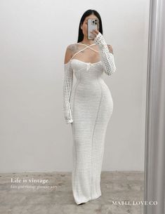 This elegant White Halter Knitting Dress is perfect for any holiday occasion. Its backless design and lace-up details add a touch of sexiness, while the knitting fabric ensures comfort and style. Maximize your fashion statement with this long autumn dress that exudes elegance. Elegant Bodycon Beach Maxi Dress, Elegant Bodycon Maxi Dress For Beach, White Maxi Dress For Winter Evening, White Maxi Dress For Evening In Winter, Elegant Stretch Crochet Dress For Beach, Elegant Crochet Knit Maxi Dress, Elegant Stretch Crochet Dress For Spring, Elegant Stretch Knit Maxi Dress, Elegant Fitted Crochet Dress For Night Out