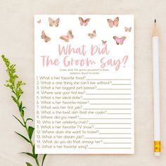 a pink and gold wedding game with butterflies on it, sitting next to a pencil