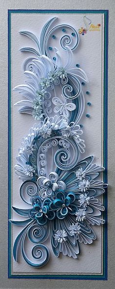 an intricately designed greeting card with blue and white swirls on the front,