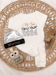 "Babies First New Year outfit  Celebrating New Year's Eve for the first time! How very exciting. Dress baby up in our My 1st New Year outfit.  your little one will look just adorable in our baby romper. You can also choose the personalized hat to complete the look and add personalization the 1st New Year's Eve outfit.   Our romper  is perfect for your little one to join in on the fun.  The optional personalized at has the perfect the finishing touch.  FOR HAT OPTIOPION PLEASE INCLUDE THE NAME NEEDED IN THE \"NOTE TO SELLER\" SECTION AT CHECKOUT. Special care goes into each garment I make. Please visit my shop policies for my production and shipping times.   Where to Personalize  In the \"notes to seller\" at checkout you can note the order with the name and size. Together with special inst New Year Outfit, Baby New Year, Personalized Hats, New Years Outfit, Eve Outfit, New Years Eve Outfits, Baby Romper, Baby Hats, New Year's