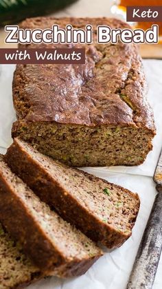 zucchini bread with walnuts is cut into slices and placed on a cutting board