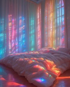 a bed sitting in front of a window covered in colorful lights