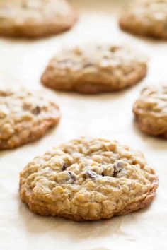 chocolate chip cookies are lined up on a baking sheet and ready to go into the oven