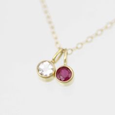 Very classy, simple, and dainty. This handcrafted gold pendant has a natural Ruby stone and comes on your choice of a 16 or an 18 inch gold chain with the artist's tag attached to the clasp. These look great when paired with other birthstone pendants or layered with other necklaces! Mix and match to create your own personalized necklace or mother necklace. Shown worn on the 16 inch chain. The pendant is also available without the chain, please make your selection when adding the item to your car Classic Pendant Birthstone Necklace Gift, Classic 14k Gold May Birthstone Necklace, Classic Yellow Gold May Birthstone Necklace, Classic Charm Necklace With Birthstone Pendant, Classic Birthstone Pendant Charm Necklace, Classic 14k Gold Birthstone Necklace, Classic Round Pendant Birthstone Charm Necklaces, Classic Round Pendant Charm Necklace With Birthstone, Classic Round Pendant Birthstone Charm Necklace