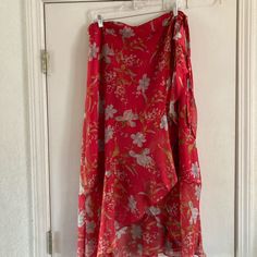 Vince Camuto, High Low, Wrap Skirt, Size 12. New Without Tags, Red Floral, With Under Slip. Great Condition, Smoke Free Home. Flattering On All Body Types. Waist-17 Inches Across Low Length-37 Inches High Length-29 Inches Long Skirt With Floral Print In Red, Red Long Skirt With Floral Print, Long Red Skirt With Floral Print, Red Floral Print Flared Maxi Skirt, Red Long Wrap Skirt For The Beach, Red Summer Wrap Skirt With Lining, Casual Red Flowy Wrap Skirt, Red Flared Wrap Skirt With Lining, Red Asymmetrical Maxi Skirt With Lining