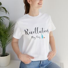 a woman wearing a white t - shirt with the words recollients on it