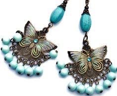 "Flirty chandelier earrings featuring filigree butterfly accents on embossed antiqued pendants that swing over dangling pale turquoise blue glass beads! Each of the butterflies are accented with painted touches of sea foam green & turquoise and little Swarovski crystal rhinestones sparkle in their centers! Each unique pendant dangles from genuine magnesite beads, too, which are thought to aid in meditation and creativity! Just dangle this unique pair from your ears to add fun, Boho style to Bohemian Dangle Jewelry With Butterfly Charm, Bohemian Jewelry With Butterfly Charm Dangle, Bohemian Butterfly Jewelry With Pierced Design, Dangle Bead Earrings, Butterfly Boho, Blue Choker Necklace, Silver Bead Earrings, Earrings Funky, Beaded Ankle Bracelets