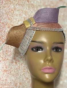 This bronze, peach, and purple pastel multicolor double disc Sinamay fascinator is trimmed withfeather stem, sinamay bows, and rhinestones. The hat pin may vary and is for decorative purposes only. Make a statement with this gorgeous piece! The hat measures approximately 9 by 4.5 inches. The hat affixes to the head by a hat elastic/string. Handmade Gifts for mom, sister, wife, or yourself. SHIPPING All items for free shipping will be shipped via USPS FIRST CLASS MAIL. Mardi Gras Party Adjustable Fascinator, Multicolor Party Hat Headpiece, Multicolor Mini Hat Headband For Party, Adjustable Multicolor Fascinator For Party, Multicolor Headband Fascinator For Party, Multicolor Headband Fascinator For Weddings, Multicolor Wedding Fascinator Headband, Elegant Multicolor Carnival Headpieces, Multicolor Wedding Headband Fascinator