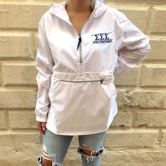 This sorority pullover windbreaker is perfect for those light rainy & windy days! This item features 3/4 front zipper, front middle pocket, and front zippered pocket. Product Details Water resistant (NOT waterproof) Only meant to be worn when there is a light rain and wind White Windbreaker, There Is A Light, Alpha Delta Pi, Football Baby, Alpha Delta, Light Rain, Sorority Gifts, Pullover Windbreaker, Capri Blue