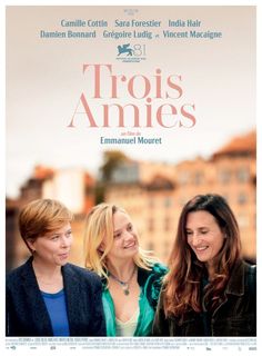 two women standing next to each other in front of a poster for the movie troiss amies