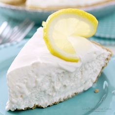 a slice of lemon pie on a blue plate