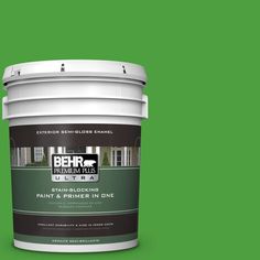 a bucket of behr premium ultra paint and primer in one on a gray background