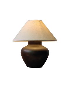 a table lamp with a brown base and a white shade on the top, against a white background