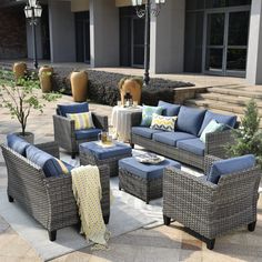 an outdoor patio with blue and yellow furniture