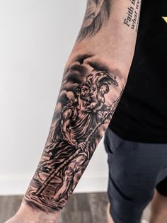 a man with a tattoo on his arm