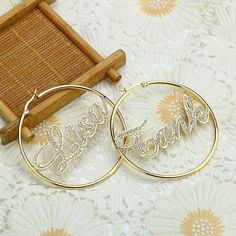 Customize 1-2 names on this pair of stylish hoop earrings with sparkling rhinestones! Each earring can be personalized with a different name. You can also choose from a variety of hoop sizes!    DESCRIPTION:  ✦ Plating: 18K Gold/Silver/Rose Gold  ✦ Base Material: Stainless Steel. Tarnish free, rust-resistant, durable and hypoallergenic. ✦ Design: Customizable with 1 or 2 Names  ✦ Letter Size: Varies, this will depend on the font and the number of letters chosen  ✦ NOTE: Please type the name in the text box and make sure to double check your spelling!  ✦ Earring Sizes: Please refer to the sizing photo and choose your desired length: - 40mm / 4cm - 50mm / 5cm - 60mm / 6cm - 70mm / 7cm - 80mm /  8cm - 90mm /  9cm - 100mm / 10cm PERSONALIZATION IDEAS:  * Boyfriend/Girlfriend Names * Inspiratio Wedding Dubai, Crystal Names, Nose Piercing Hoop, Name Earrings, Bamboo Earrings, Earring For Women, Custom Earrings, Trendy Earrings, Custom Necklace