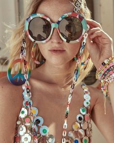 Far out, man! These super fun sunnies are the physical embodiment of Peace, Love, and Fabulous! Made of a round, multicolored frame with an all-over geometrical pattern these sunnies are the perfect accessory for bringing the bohemian hippie vibes with you everywhere you go! The stems have removable hanging colorful peace sign tassels at the temple and a removable, multicolored acrylic chain that can also be worn as a groovy mask chain. These fabulous sunnies ship with a cleansing cloth and prot Geometrical Pattern, Hippie Peace, Mask Chain, Hippie Vibes, Good Humor, The Bohemian, Bohemian Hippie, Resort Collection, Hippie Bohemian