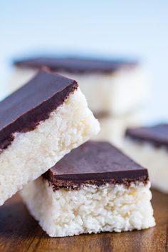 three pieces of chocolate and coconut on top of each other