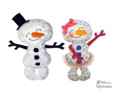 two stuffed snowmen standing next to each other in front of a white background,