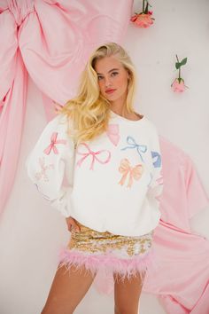 Get cozy and stylish in our BOW PRINT PULLOVER! Embrace the oversized fit and stay trendy with colorful bow prints. This pullover is the perfect addition to your wardrobe. Just remember to hand wash for long-lasting wear. (Don't worry, we won't judge if you wear this every day.) This is a made-to-order item. All customized orders are currently shipping within 14 business days. To receive item quicker, expedited shipping is available at checkout. **For reference, the model is 5'8 and wearing a si Trendy Outfits Christmas, Bow Clothes, Bow Outfit, Bow Sweater, Bow Print, Modieuze Outfits, Cold Weather Outfits, Stylish Clothes For Women, Cute Summer Outfits